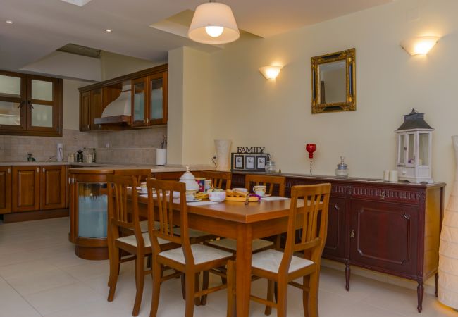 Modern House next to the Beach,Rethymno,Open-plan kitchen and dining table Modern House next to the Beach,Rethymno,Open-plan kitchen and dining table