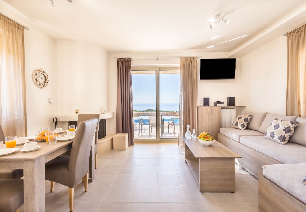 Villa with sea views,Triopetra,Rethymno,Living and dining area with fireplace Villa with sea views,Triopetra,Rethymno,Living and dining area with fireplace