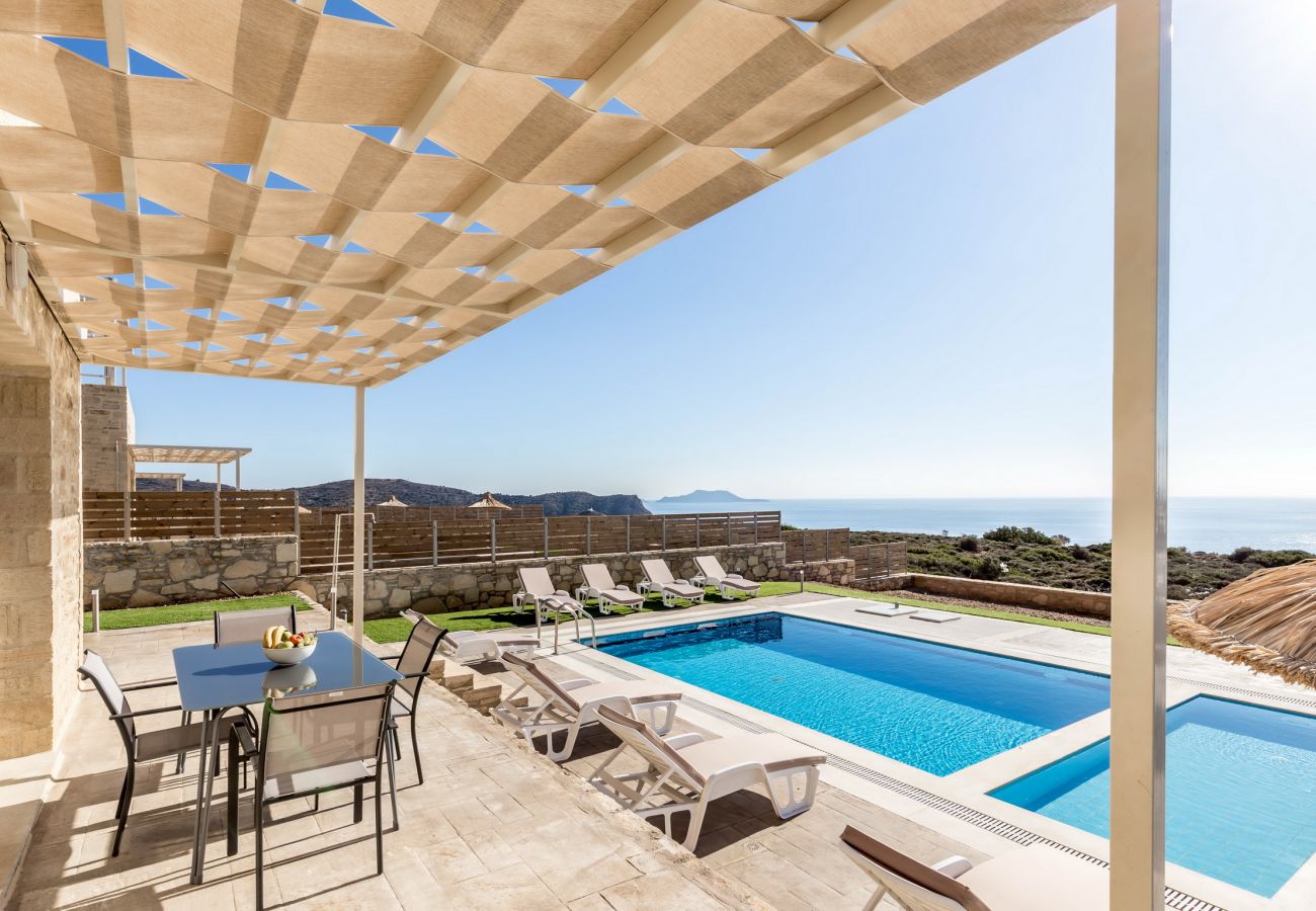 Exterior area with shaded pergola and swimming pool,Triopetra,Rethymno Exterior area with shaded pergola and swimming pool