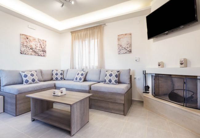 Modern living room with fireplace,Triopetra,Rethymno Modern living room with fireplace