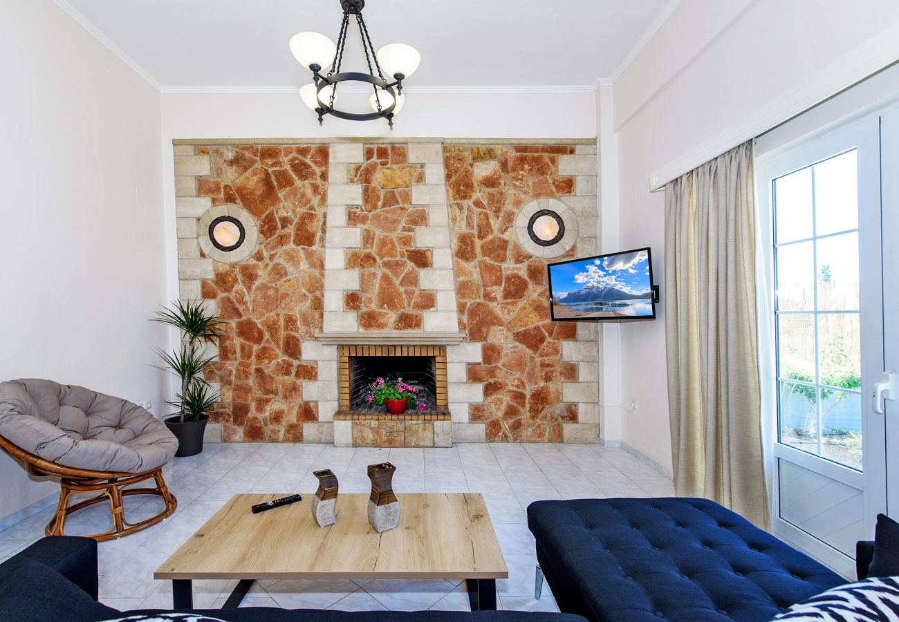 Living area and fireplace of Modern villa, Platanes, Rethymno, Crete Living area and fireplace of Modern villa, Platanes, Rethymno, Crete
