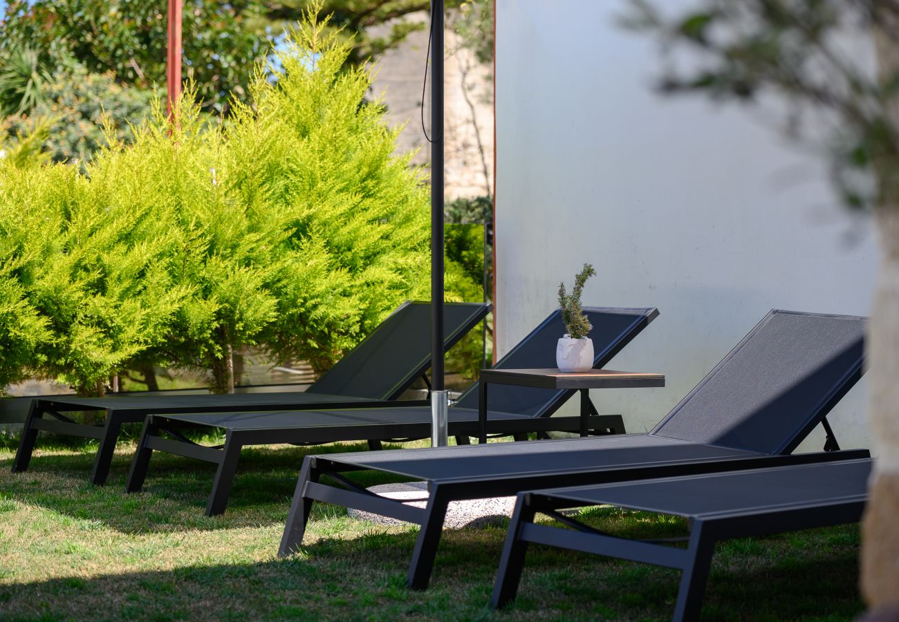 Garden area, relaxing sunbeds in Stone Project villa, Pigi Rethymno Garden area, relaxing sunbeds in Stone Project villa, Pigi Rethymno